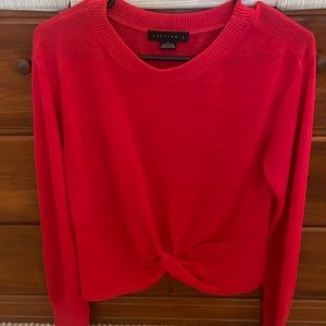 Red cross hem sweater